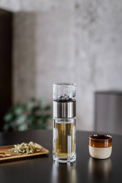 istock brewing herbal tea in glass infuser or travel bottle 1412516905
