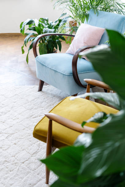 istock Retro armchairs on the white carpet floor 1412517006