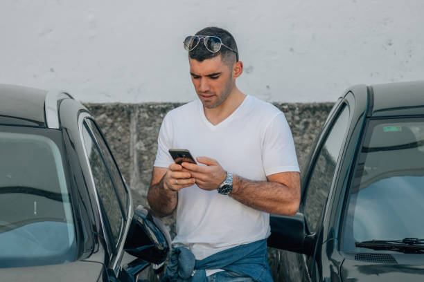 istock man buying car with mobile phone 1412518137