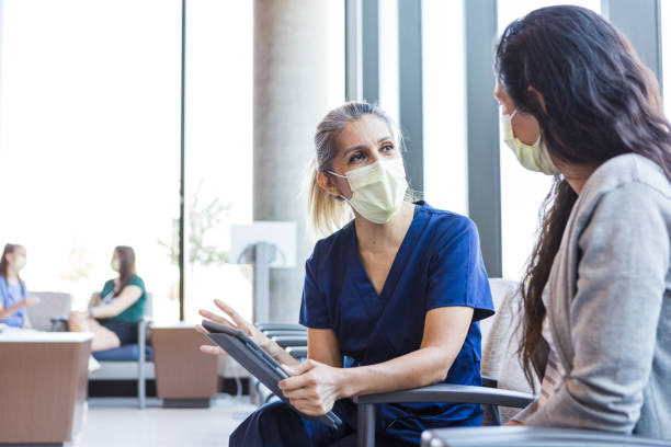 istock Nurse meets with family member 1412518726