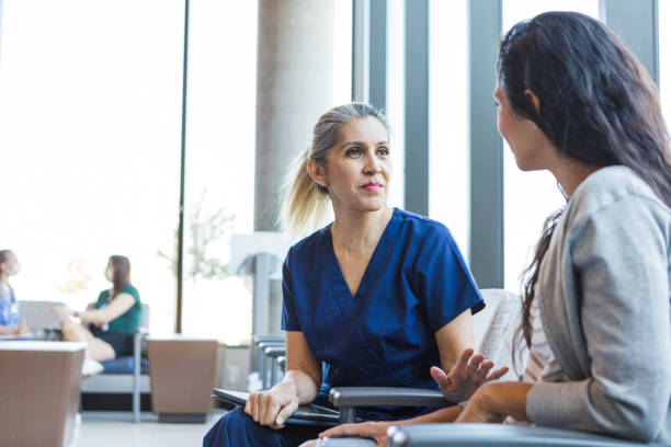 istock Nurse listens to patient 1412518754