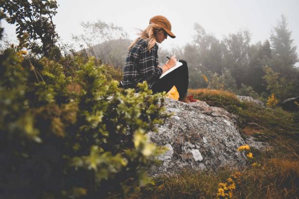 Woman Writing on a Mountain