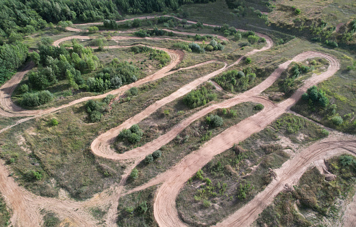 Offroad track for motocross on bright sunny day aerial view
