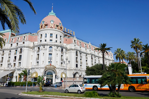 Nice, France - September 20, 2018: The large palace building with its bright color and decorated facade houses the world-famous luxury hotel Negresco.