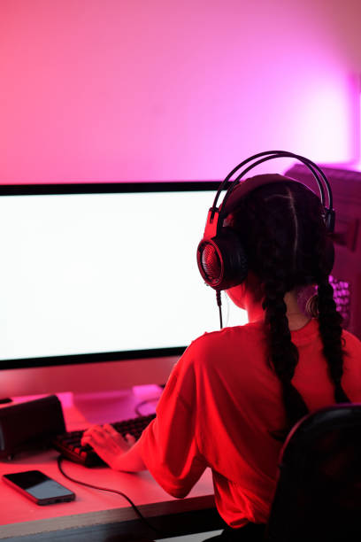 istock Little Girl Playing Videogame 1412525498