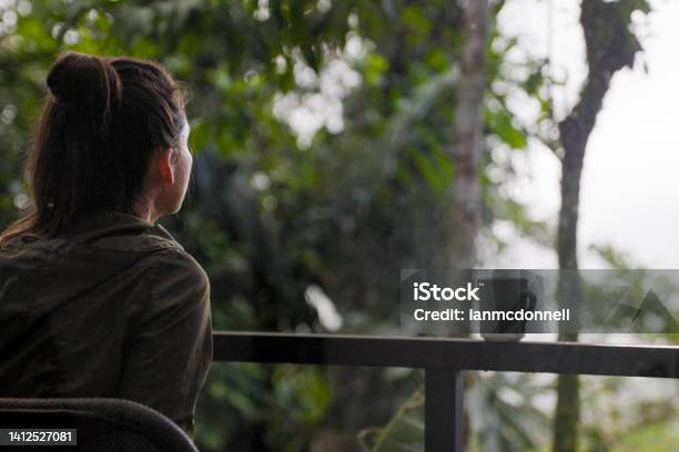 Woman Drinking Coffee And Enjoying The View In The Rainforest Of Arenal Costa Rica Stock Photo - Download Image Now