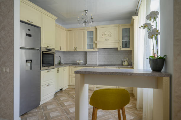 istock Interior of modern trendy cream colored kitchen 1412527103