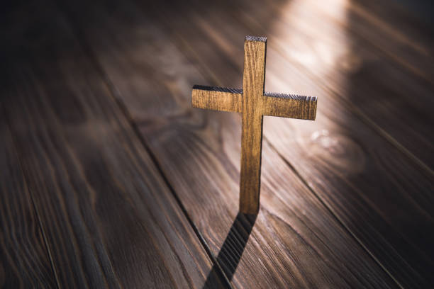 istock cross with on the old wooden floor 1412528396