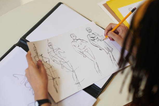 istock Fashion Designer Working on Sketches 1412528783