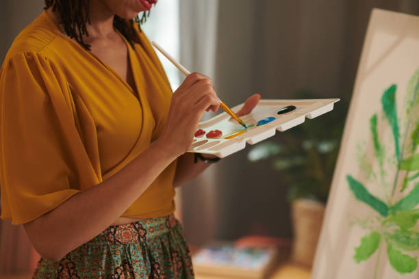 istock Female Painter Mixing Colors 1412528823