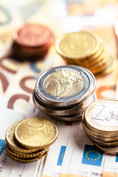 istock Euro coins on euro banknotes 1412531555