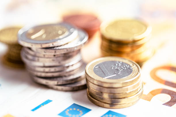 istock Euro coins on euro banknotes 1412531566