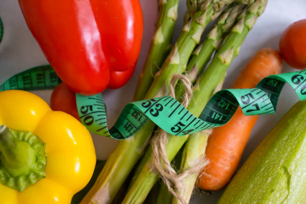 istock Measuring tape vegetables and fruits 1412531783