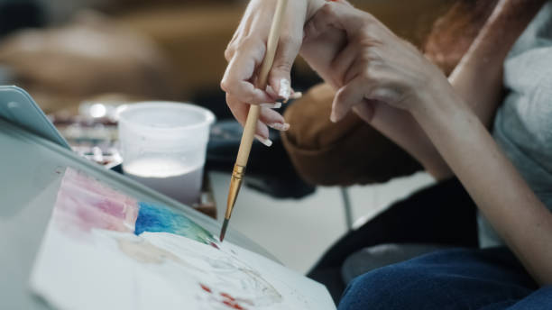Woman with a disability using watercolor