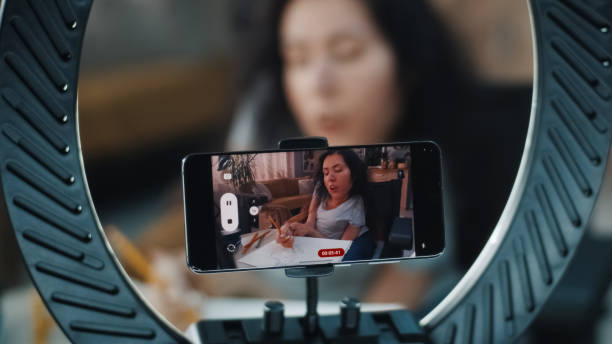istock Woman with a disability drawing on camera 1412533055