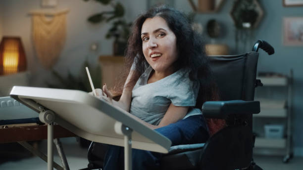 Female artist with disability looking at the camera