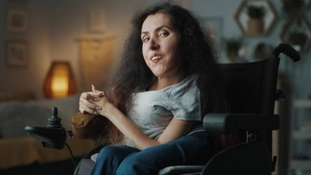 istock Joyful woman with spinal muscular atrophy 1412533235