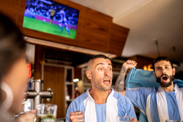 istock Friends watching Argentinian team playing in a bar 1412534505