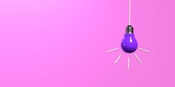 Hanging Idea light bulb on a colored background stock photo