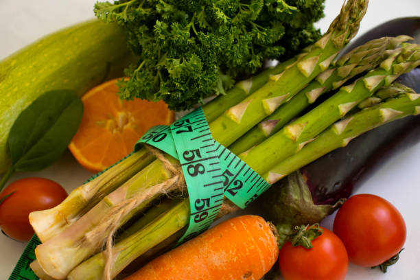 istock Measuring tape vegetables and fruits 1412534708