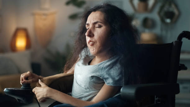 istock Depressed woman with a disability at home 1412534807