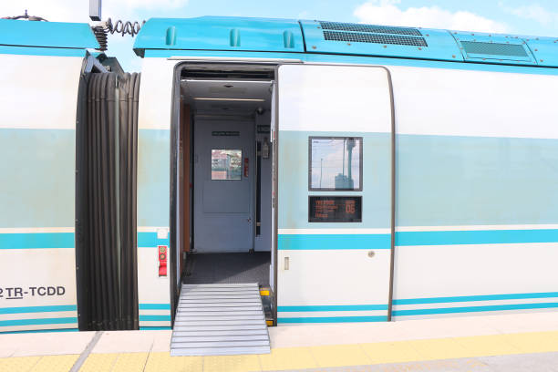 istock blue and white bullet train car with open sliding mechanical doors on train station platform 1412536855