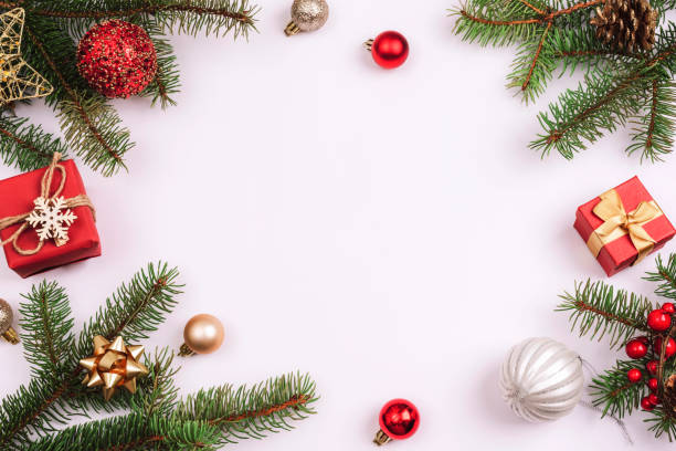 istock Christmas background, fir branches, gift boxes, red balls and Christmas decorations on white background. Top view, flat lay, copy space 1412536902