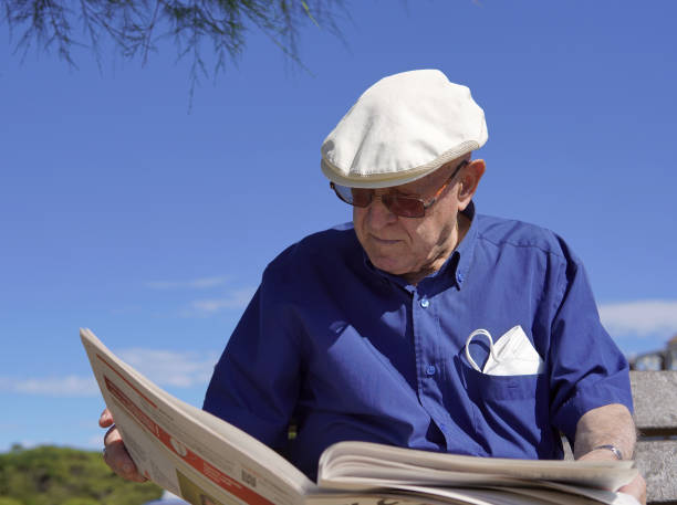 istock an older gentleman looking the news 1412537726
