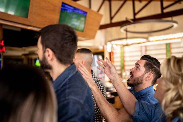 istock Friends watching match in a bar 1412538115