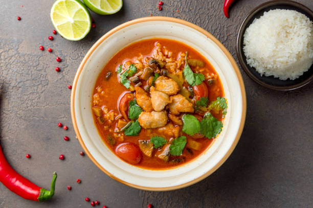 istock Tom Yam soup with chicken on brown table top view 1412538801