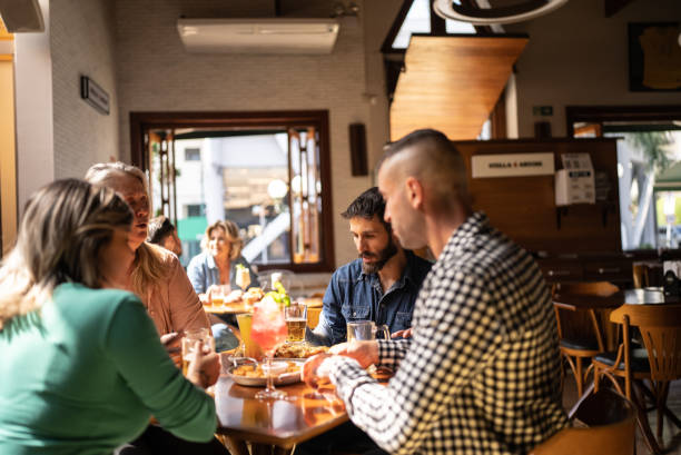 istock Friends talking at a bar 1412539236