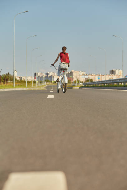 istock woman on bike 1412541189