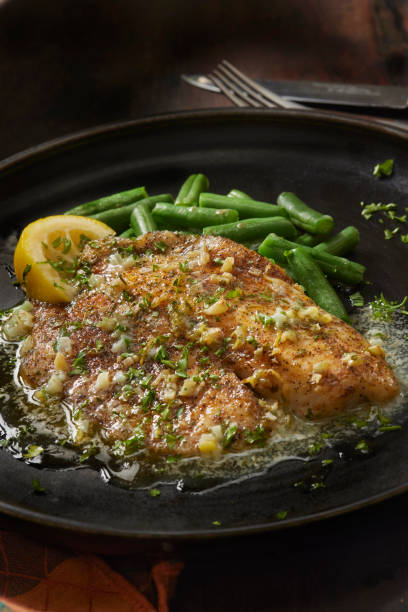 istock Baked Tilapia in a Lemon, Garlic and Butter Sauce 1412544252