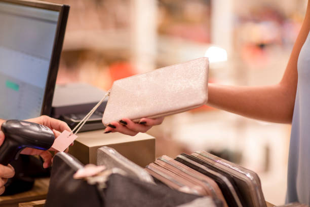 istock Close up on a female hand holding a small purse before paying 1412545204