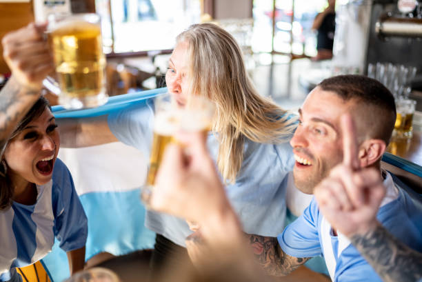 istock Argentinian team fans celebrating in a bar 1412545473