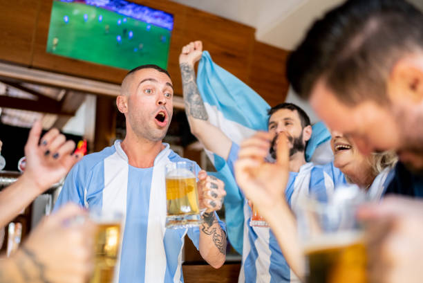 istock Argentinian team fans celebrating in a bar 1412545494