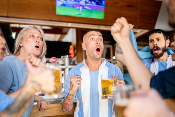 istock Argentinian team fans celebrating in a bar 1412545499