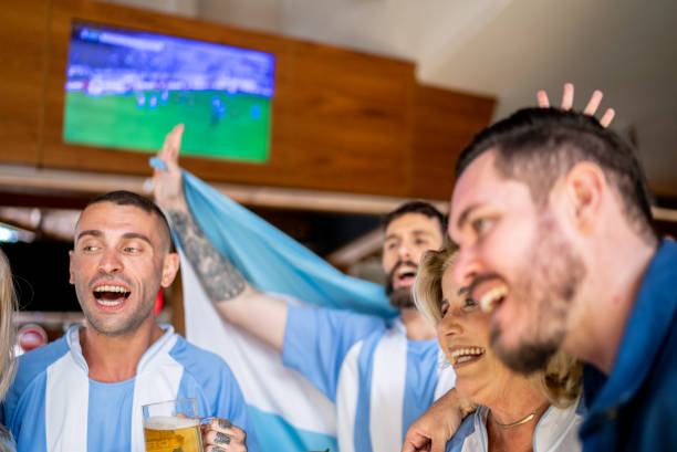 istock Argentina team fans celebrating in a bar 1412545513