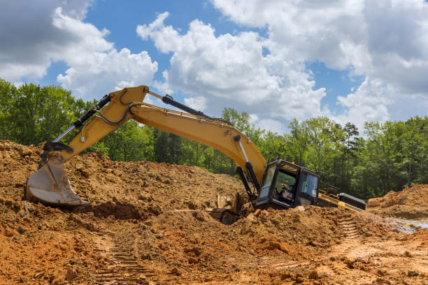 istock In the course of construction work, the excavator became stuck in a deep pit o 1412546238