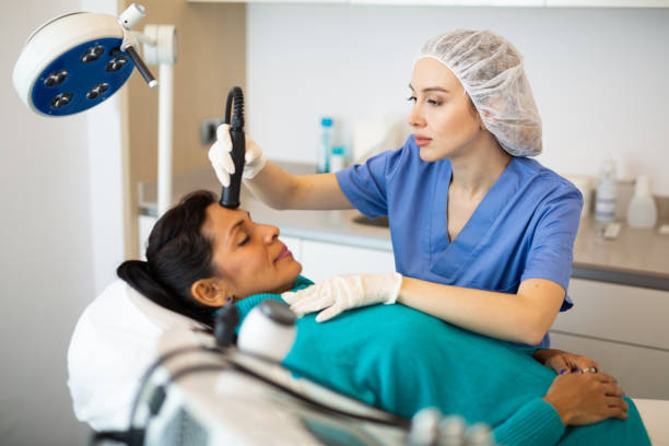 istock Female comsetologist making needle-free mesotherapy for woman 1412546857