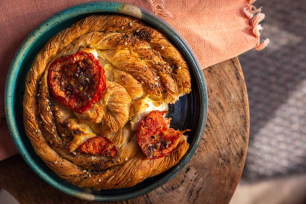 istock Flat lay breakfast pastry danish with tomatoes and goat cheese 1412549561