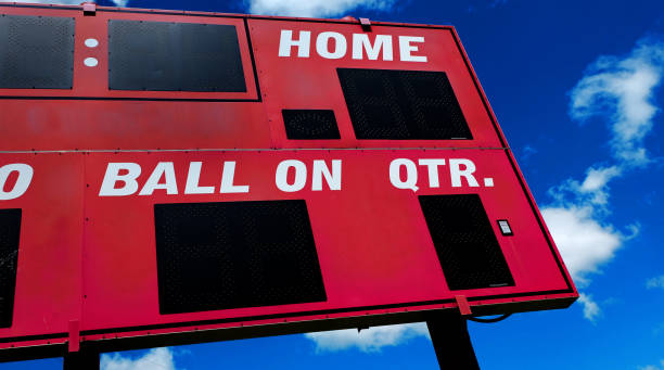 istock Baseball Scoreboard Competition with Blue Sky and Clouds 1412553679