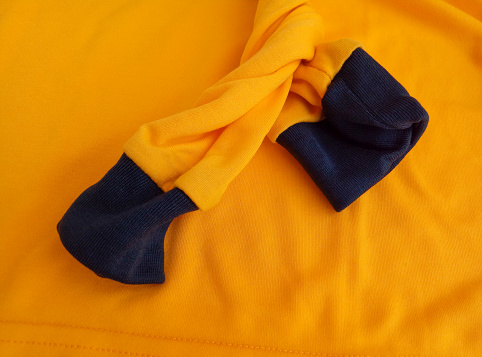orange long sleeve soft cotton t-shirt with black sleeve cuffs
