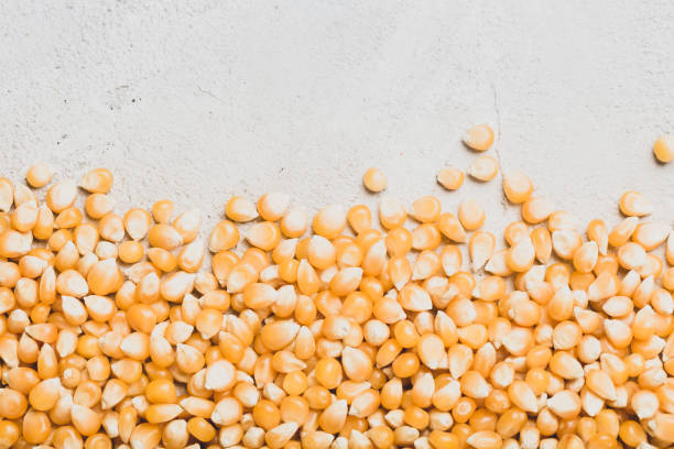 istock pile of corn kernels for popcorn, top view 1412553722