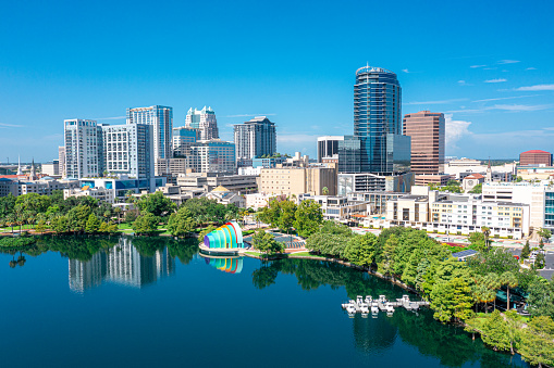 Aerial view of Orlando skyline and reflection in Lake Eola.