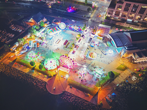 Aerial drone view of a carnival at night.