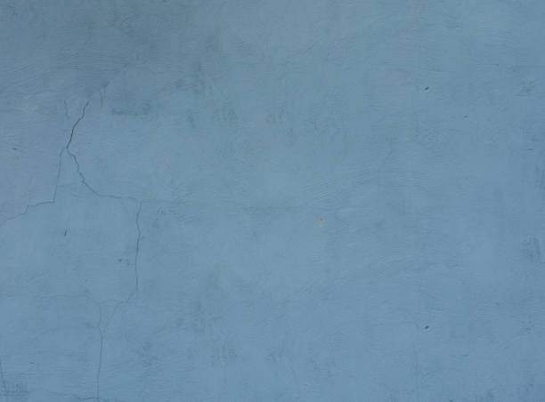 istock Abstract background of old blue plaster on the wall. 1412563345