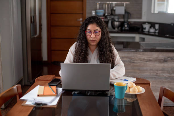istock Latin woman taking an online course 1412564087
