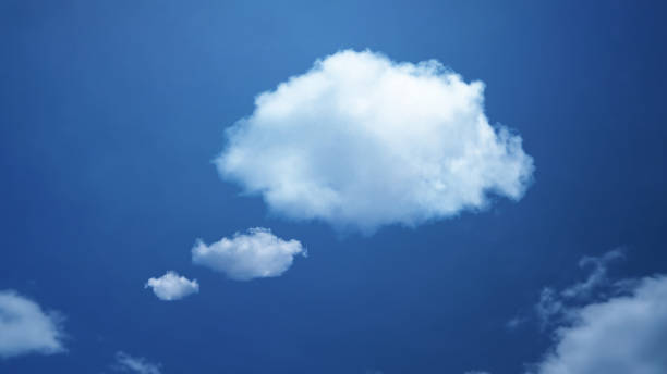 istock White cloud shape of a thinking balloon at blur sky background, concept communication. 1412565991