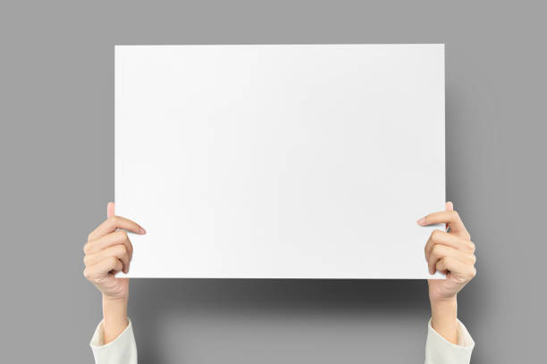 istock Hand holding a2 size paper for announcement, paper for protest, template mockup for text. 1412566494